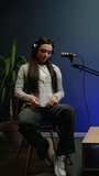 Female Podcast Host Engages Live - Powered by Shutterstock - Get 15% off with code: PIKWIZARD15