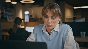 Confident employee video calling laptop camera having virtual conference sitting office closeup. Serious business woman talking discussing work results. Girl manager sharing news at online meeting  - Powered by Shutterstock - Get 15% off with code: PIKWIZARD15