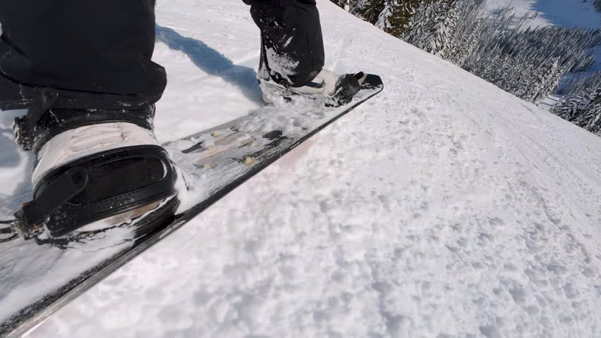Snowboard Carving Groomed Snow at Ski Resort