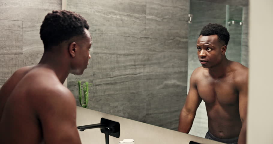 Man, mirror and motivation talking in bathroom for manifestation, positive affirmation and ego boost. Happy black person, body and growth mindset speech in home morning routine for goals reflection
