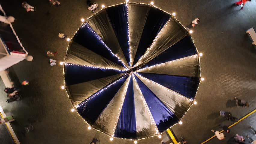 The Piazza Navona carousel, icon of Christmas and Epiphany in Rome, Italy.
Aerial view from the Piazza Navona carousel set up for Natale 2024, Epifania. Night, Rome, Italy.