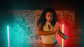 Talented African woman dancing hip-hop and ethnic choreography, energy of music . Attractive mixed race female dancer moving slowly by favorite song in dance class, slender body of beautiful lady - Powered by Shutterstock - Get 15% off with code: PIKWIZARD15