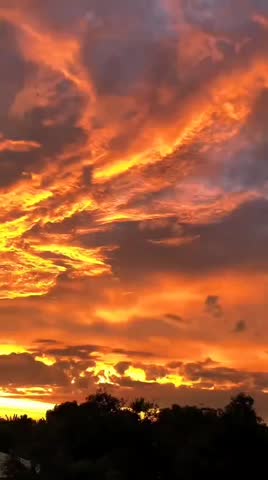 the beauty of the orange sky and clouds in the afternoon
