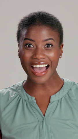 Face, shocked or excited black woman in studio for good news, wow or surprise in Nigeria. Portrait, screaming or African girl with smile for announcement, winning or omg reaction on gray background
