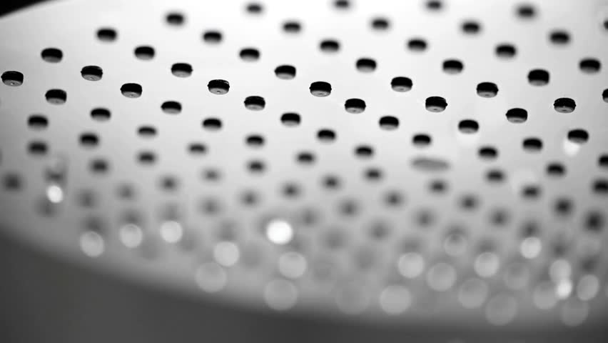 closeup Water drops in the shower head pouring from the showers bathroom 4k footage refreshing