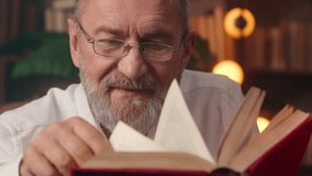 Caucasian old man reading book textbook hobby home library male businessman grandfather mature ready reader pensioner senior novel professor literature glasses health interest business office inside - Powered by Shutterstock - Get 15% off with code: PIKWIZARD15