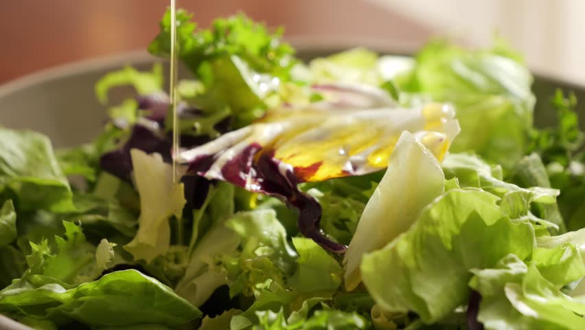 Vegetarian salad with fresh vegetables. Spilled with olive oil. Close up tasty and healthy food. High quality 4k footage