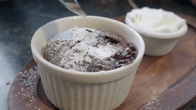 Delicious Chocolate Lava Cake with Powdered Sugar and Whipped Cream on Wooden Plate - Powered by Shutterstock - Get 15% off with code: PIKWIZARD15
