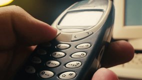Man arm holding phone cellphone, vintage retro mobile phone, text message sms. - Powered by Shutterstock - Get 15% off with code: PIKWIZARD15