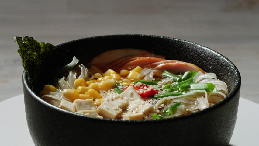 Japanese Ramen with Beef or chicken, rice noodles with fried meat, Tom Yam kung Spicy Thai asian soup, chef cooking in traditional korean chinese food. Close up of tasty korean cuisine. 