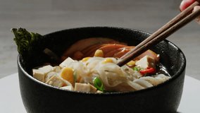 Japanese Ramen with Beef or chicken, rice noodles with fried meat, Tom Yam kung Spicy Thai asian soup, chef cooking in traditional korean chinese food. Close up of tasty korean cuisine.  - Powered by Shutterstock - Get 15% off with code: PIKWIZARD15