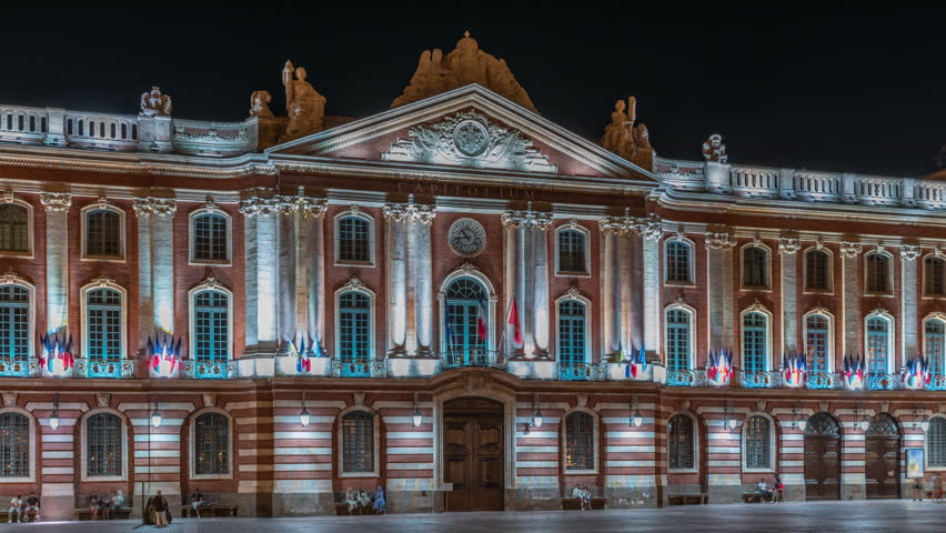The Capitole de Toulouse night timelapse hyperlapse showcases illuminated historic city hall and municipal heart of Toulouse, France, located at Place du Capitole main square in downtown