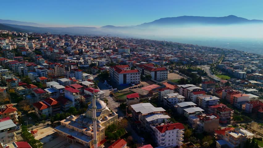 Izmir city center foggy remote aerial shot with flag Bornova