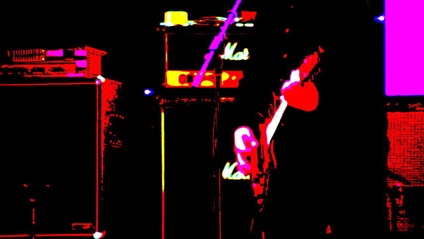 Concert. The guitarist plays on stage. Only the main colors