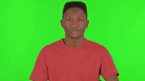 Waiting Young African Man Checking Time on Green Background - Powered by Shutterstock - Get 15% off with code: PIKWIZARD15