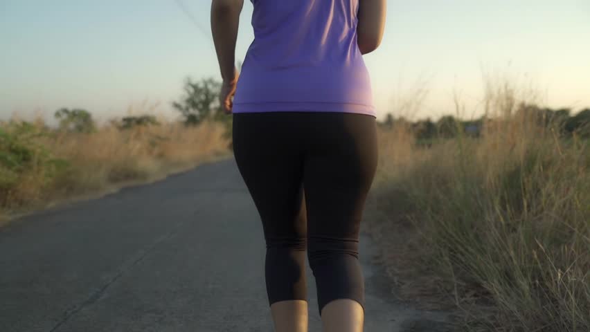 Woman running outdoors in the evening