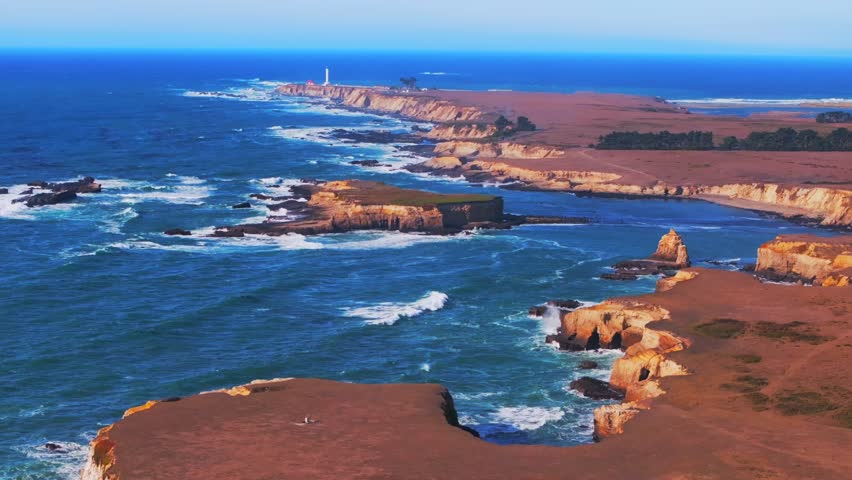 Stornetta coastal Trail Point Arena Lighthouse islands Racas Sea Lion Rocks Cove California aerial drone Mendocino coast vista point sunny daytime morning afternoon blue sky waves autumn static shot