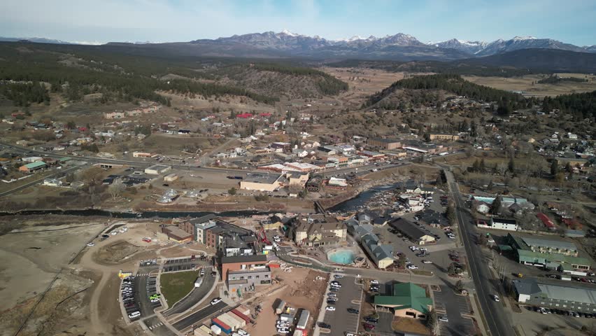 High aerial above mountain town of Pagosa Springs Colorado in winter