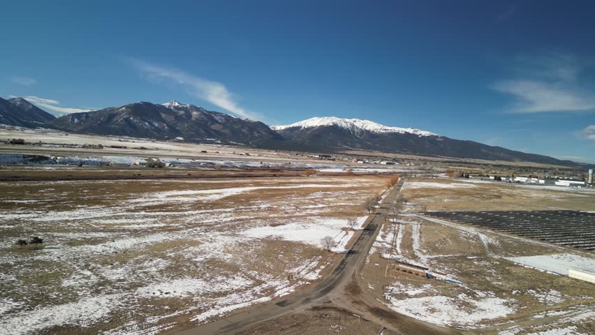 Aerial of Collegiate Peaks and Buena Vista Colorado along Highway 285 in winter