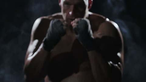 Kickboxer shadow boxing as exercise for the big fight, shot on Red Epic