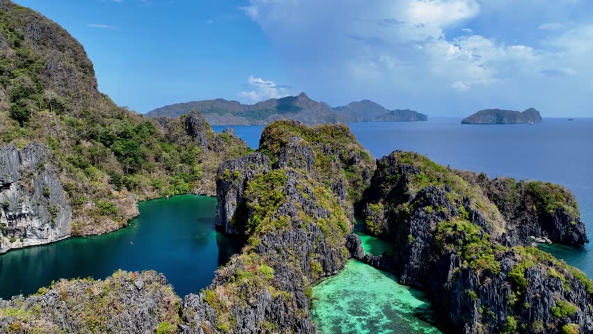 Aerial top view of Traditional filipino boat bangka or banca at the blue lagoon in El Nido province, Palawan island in Philippines	