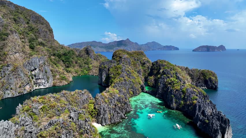 Aerial top view of Traditional filipino boat bangka or banca at the blue lagoon in El Nido province, Palawan island in Philippines	