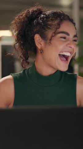 Excited woman, night and winning with laptop in celebration for promotion, good news or lottery prize at office desk. Happy, female person or employee working late with smile for success at workplace