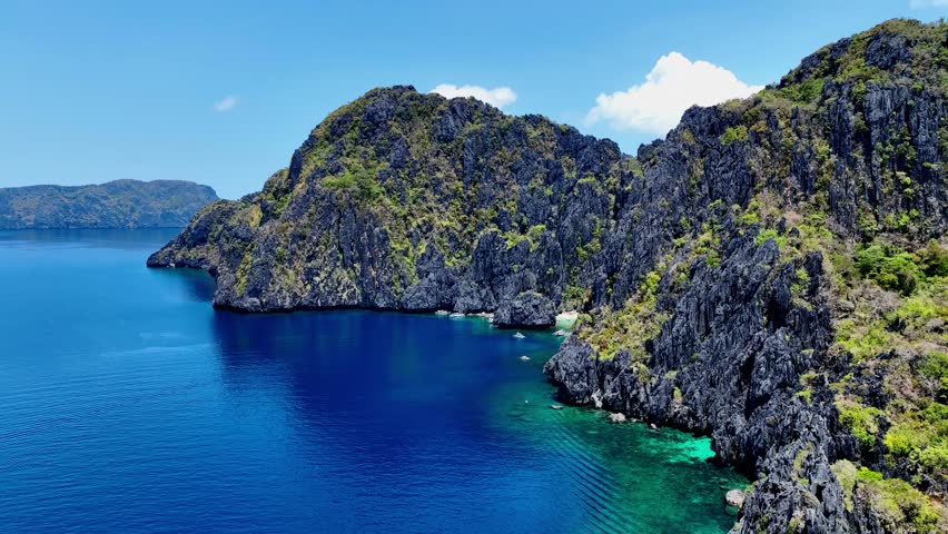 Aerial top view of Traditional filipino boat bangka or banca at the blue lagoon in El Nido province, Palawan island in Philippines	