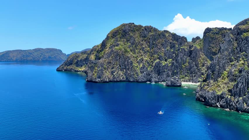 Aerial view of Traditional filipino boat bangka or banca at the blue lagoon in El Nido province, Palawan island in Philippines	