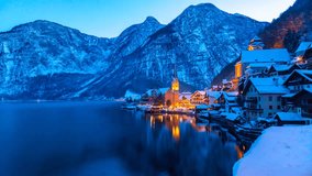 Hallstatt mountain village Time Lapse Video with Lake Hallstatt (Hallstatter See) in the Austrian Alps, day to night lapse in 4K at sunset in winter with snow. - Powered by Shutterstock - Get 15% off with code: PIKWIZARD15