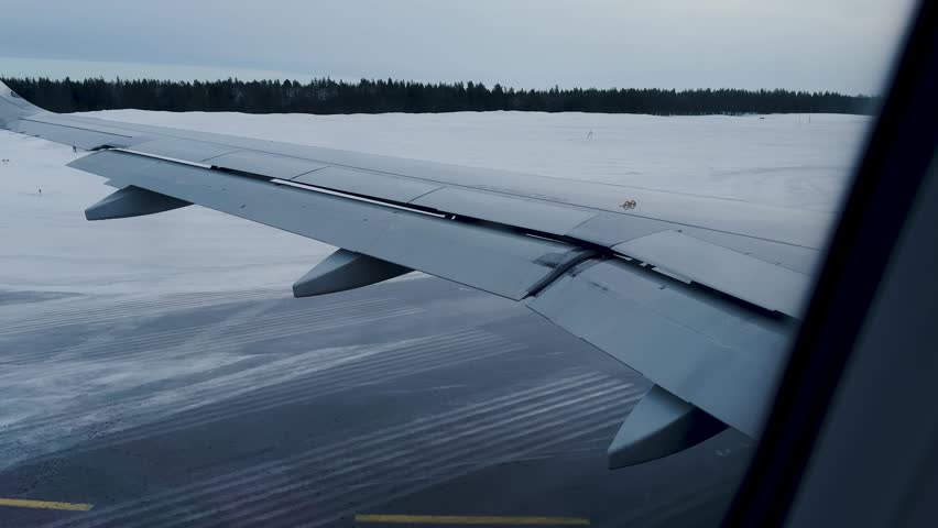Winter flight to Lapland. Winter in the heart of the polar lands of Lapland. Snow-capped mountains. Lulea Airport with pre-departure airport services.