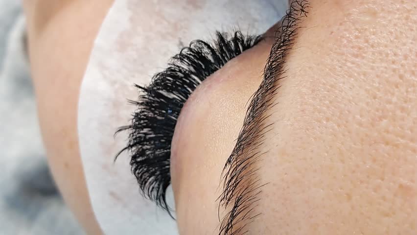 Close up of eye with eyelash extensions ,beauty salon treatment ,2d volume, 3d volume, classical lashes,Russian volume,megavolume, new set