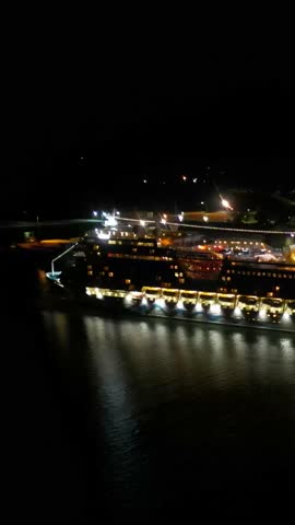 nighttime cruise ship docked moored port dark waters illuminated vessels invergordon aerial night drone shot travel holiday adventure harbor scenic nature exploration journey outdoor