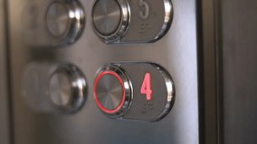 Unrecognized man pressing button of elevator with the polished metal surface. An elevator panel lights up while ascending to the fourth floor. Modern hotel concept. - Powered by Shutterstock - Get 15% off with code: PIKWIZARD15