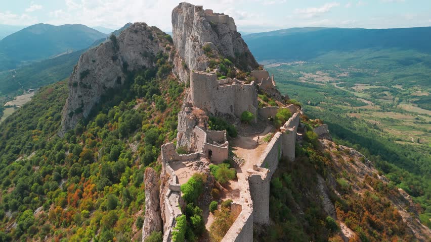 Aerial view of the Cathar medieval castle of Peyrepertuse in the Aude department, southern France. The ruins of magnificent historic castle situated in the French Pyrenees
