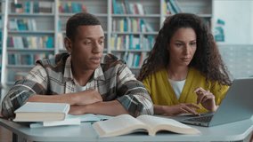 Tired exhausted sleepy African American man students Hispanic Arabian woman classmates project studying learning library lazy university laptop typing computer girl guy yawn sleeping high school team - Powered by Shutterstock - Get 15% off with code: PIKWIZARD15