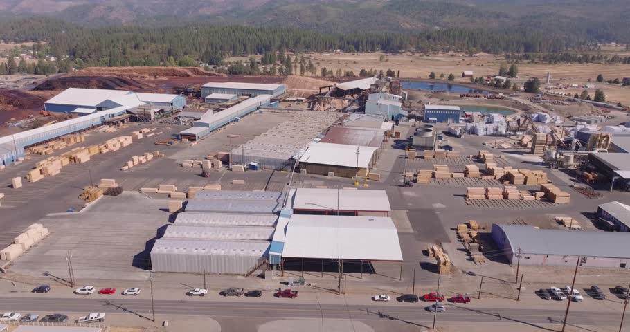 CA sawmill aerial view on a sunny day, showcasing industrial buildings