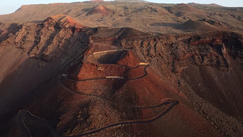 Canary Islands serpentine road through El Hierro’s rugged volcanic landscape, 4K