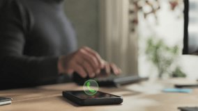 person at computer receiving phone call on smartphone mobile,male employee at the desk receives phonecall,icon symbol showing on the screen - Powered by Shutterstock - Get 15% off with code: PIKWIZARD15