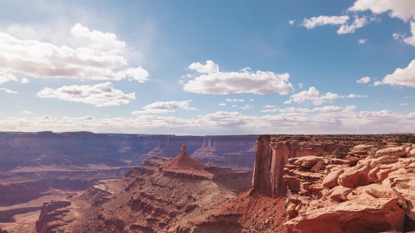 Time Lapse of the clouds moving above the rugged landscape near Canyonlands National Park in Moab Utah.