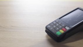 Customer making a contactless payment transaction using smartphone on a pos terminal - Powered by Shutterstock - Get 15% off with code: PIKWIZARD15