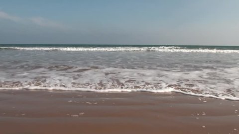 Ocean Waves and Beach: The waves from the sea of Bay of Bengal  come rushing to the coast in Chirala town of Andhra Pradesh, India.
