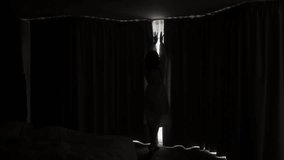 Slow motion of woman in robe opens curtains in room, revealing forest view outside. Wake up at the morning, weekend vacation on nature. Designed luxury home interior. self-care, new day starting - Powered by Shutterstock - Get 15% off with code: PIKWIZARD15