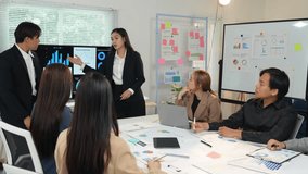 Group of business people meeting about business plans Presenting and explaining financial charts of partners from papers, graphs, and data on a laptop, or PC at the office. - Powered by Shutterstock - Get 15% off with code: PIKWIZARD15