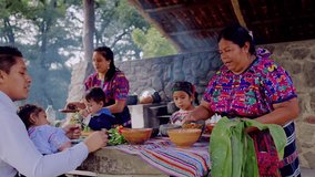 A mature Latina woman of the Mayan ethnic group leads the family to participate in the preparation of organic corn tamales.	 - Powered by Shutterstock - Get 15% off with code: PIKWIZARD15
