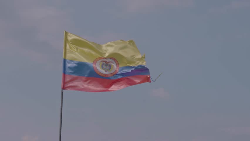 Colombian Pride, National Flag with Emblem on a Clear, Beautiful Day