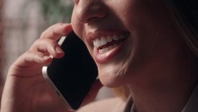 Close up happy laughing smiling unknown Caucasian joyful female mouth talking smartphone business woman conversation businesswoman girl office worker speaking mobile phone cellphone call smile indoors - Powered by Shutterstock - Get 15% off with code: PIKWIZARD15
