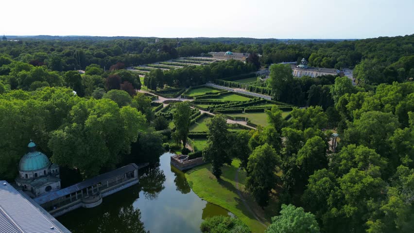 Sunny summer day Potsdam sanssouci Palace showing the beautiful green gardens and surrounding area. Lovely aerial view flight overflight flyover drone