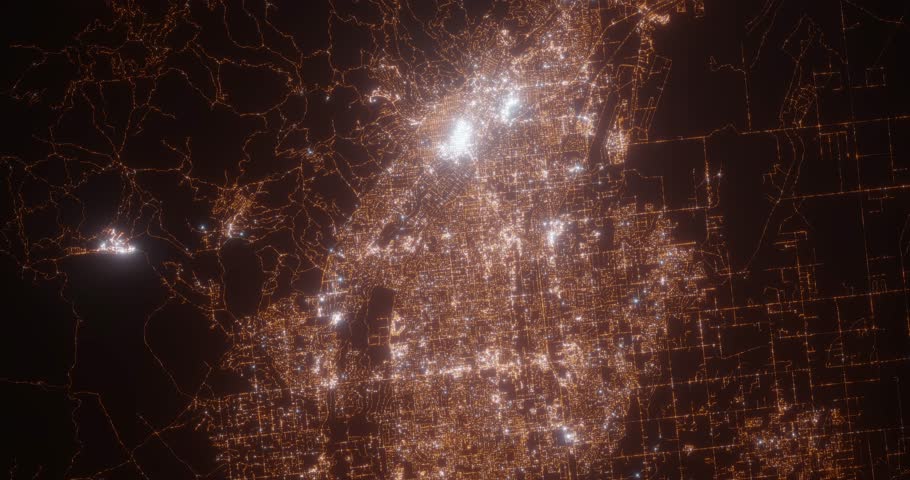 Boise (Idaho, USA) aerial view at night. Top view on modern city with street lights. Camera is zooming out, rotating counterclockwise. Vertical video. The north is on the left side
