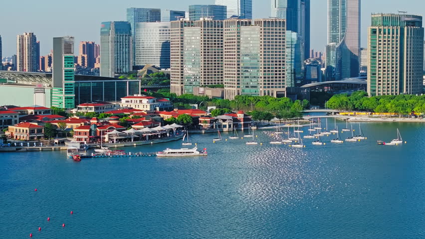 Aerial shot of cruise ships on the pier and modern urban buildings in Suzhou, China